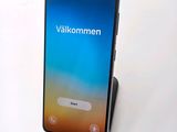the back of a phone with a display on it sitting on top of a table