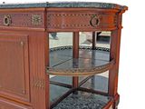 a wooden cabinet with a marble top and a glass door