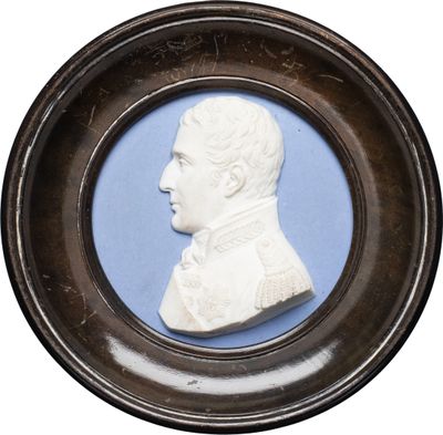 portrait of a man in profile in a wooden frame with a blue background
