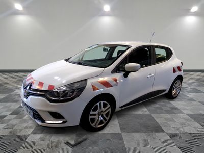 the white car is parked on a checkered floor in the garage