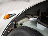 a close up of a car ' s engine with its hood open