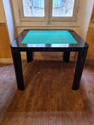 a table with a glass top in front of a window