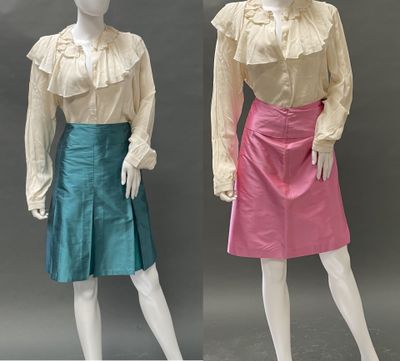 two mannequins dressed in different colors of clothing
