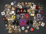 many different types of badges and badges on the table