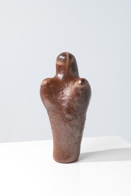 sculpture of a human hand on a white surface