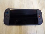 a close up of a nintendo wii controller on a table