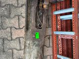 a large metal pipe attached to the side of a building