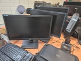 a lot of computers that are sitting on a desk