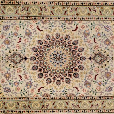 an antique persian rug with a medallion design