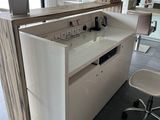 a desk with a mirror and a chair in the room