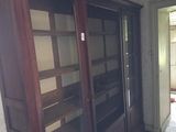 a large wooden cabinet in the middle of a room