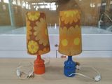 two lamps that are sitting on a table