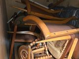 a pile of old furniture in a small room