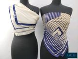 deux mannequins, l'un portant un haut bleu et blanc et l'autre un haut blanc et bleu