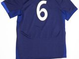 a blue soccer jersey with the number 6 on it