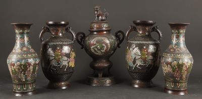 five vases with different designs on them on a table