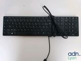 a black keyboard with a cord attached to it