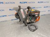 a close up of a chainsaw on a table in front of a wall