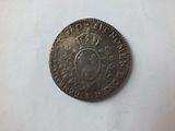 a close up of a coin with a crown on top of it