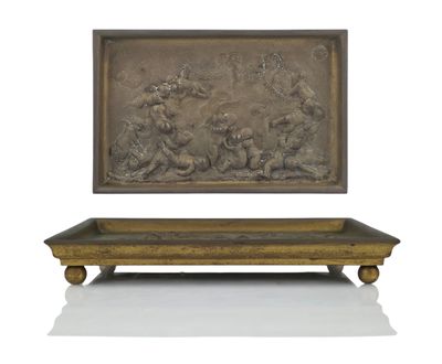 an image of a bronze plaque depicting a group of people on a bench