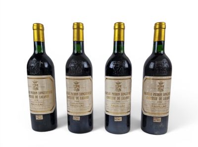 three bottles of wine sitting next to each other on a white surface