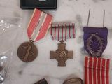 many medals and medals on a marble counter top