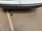a picture of a white van parked in a parking lot