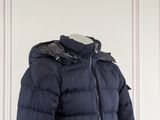 the jacket is blue and has a hood on it