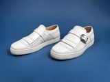 a pair of white shoes on a blue background