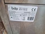 a label on the side of a machine that is sitting on the ground