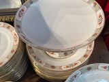 a lot of plates that are sitting on a table