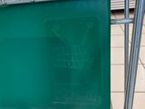 a shopping cart that has a green sign on it