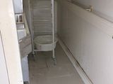 a bathroom with a toilet and a sink in it