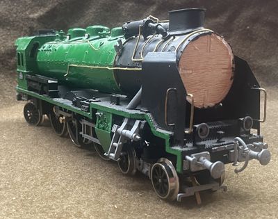 a toy train that is sitting on the tracks