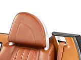 a close up of a car seat with a tablet on it