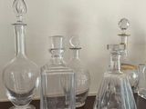 a lot of glass bottles sitting on a table