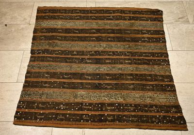 rug on the floor in a room with tile flooring and tile flooring