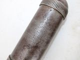 a metal pipe that is on a white surface