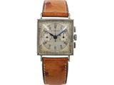an image of a watch with a brown leather strap