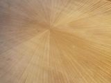 a wooden table with a circular design on it