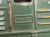 a close up of a green toy truck with a hole in the side