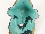 an image of a turquoise colored bowl with a face on it