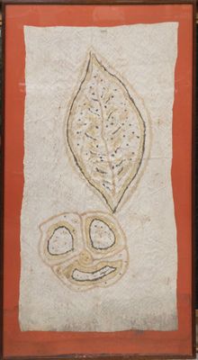 painting of a leaf and a flower on a wall in a wooden frame