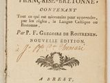 un vieux livre écrit posé sur une table