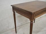 a small wooden table with a drawer on top of it