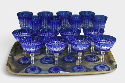 a tray with a tray of blue wine glasses on it