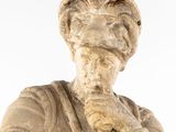 a statue of a man with a hat on his head