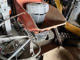 a pile of construction equipment sitting in a garage