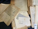 a pile of old papers sitting on top of a table