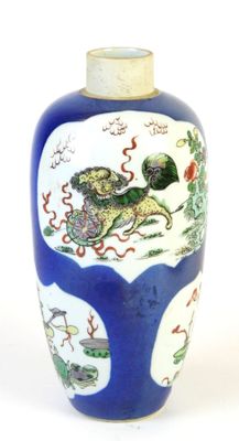 a blue and white vase with a painting on it